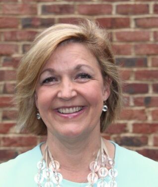 Caroline Williamson headshot for 100 Women website